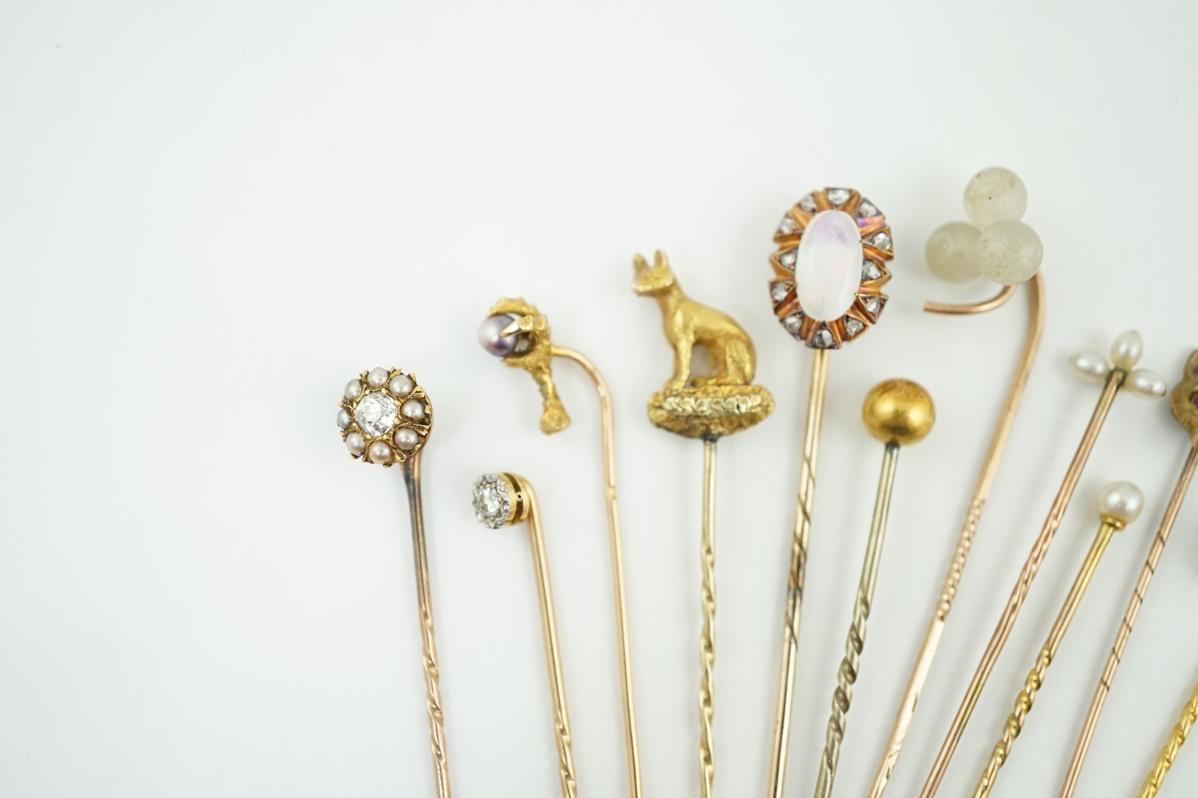 A collection of eleven assorted early 20th century and later stick pins